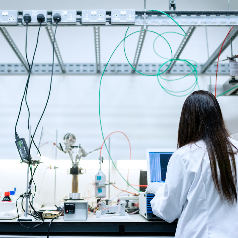 Women scientist working with lab equipment